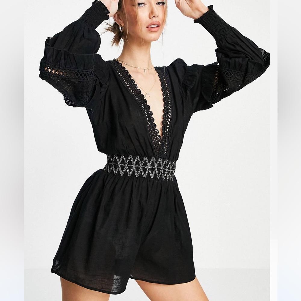 A black V neck beach romper sleeved